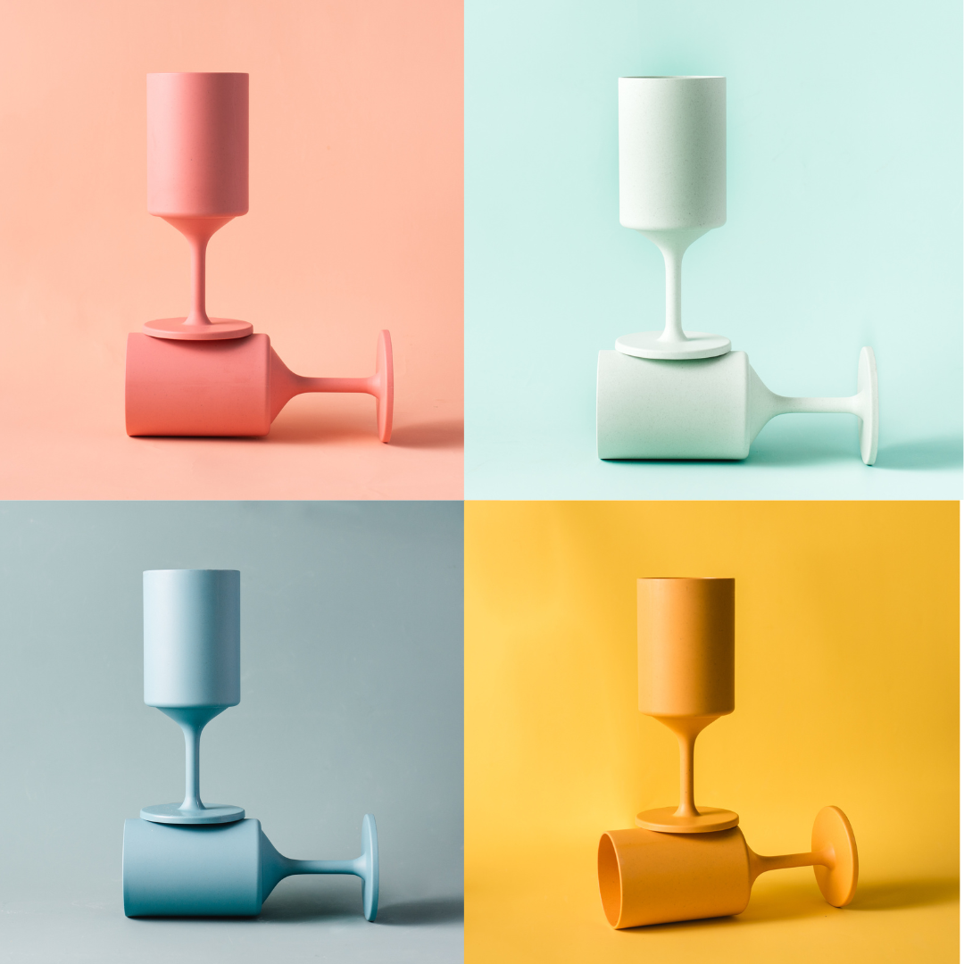 Four colorful ceramic vases on a multicolored background