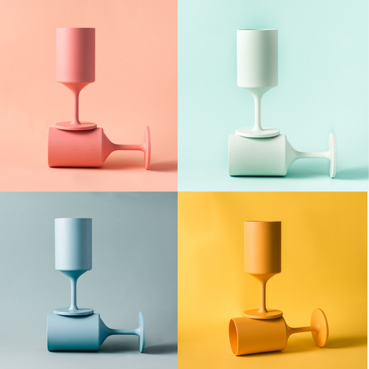 Four colorful ceramic vases on a multicolored background